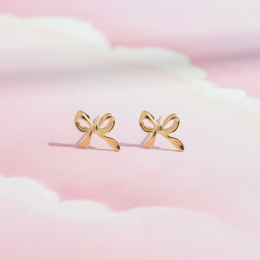 Dainty Golden Bow Stud Earrings flatlay