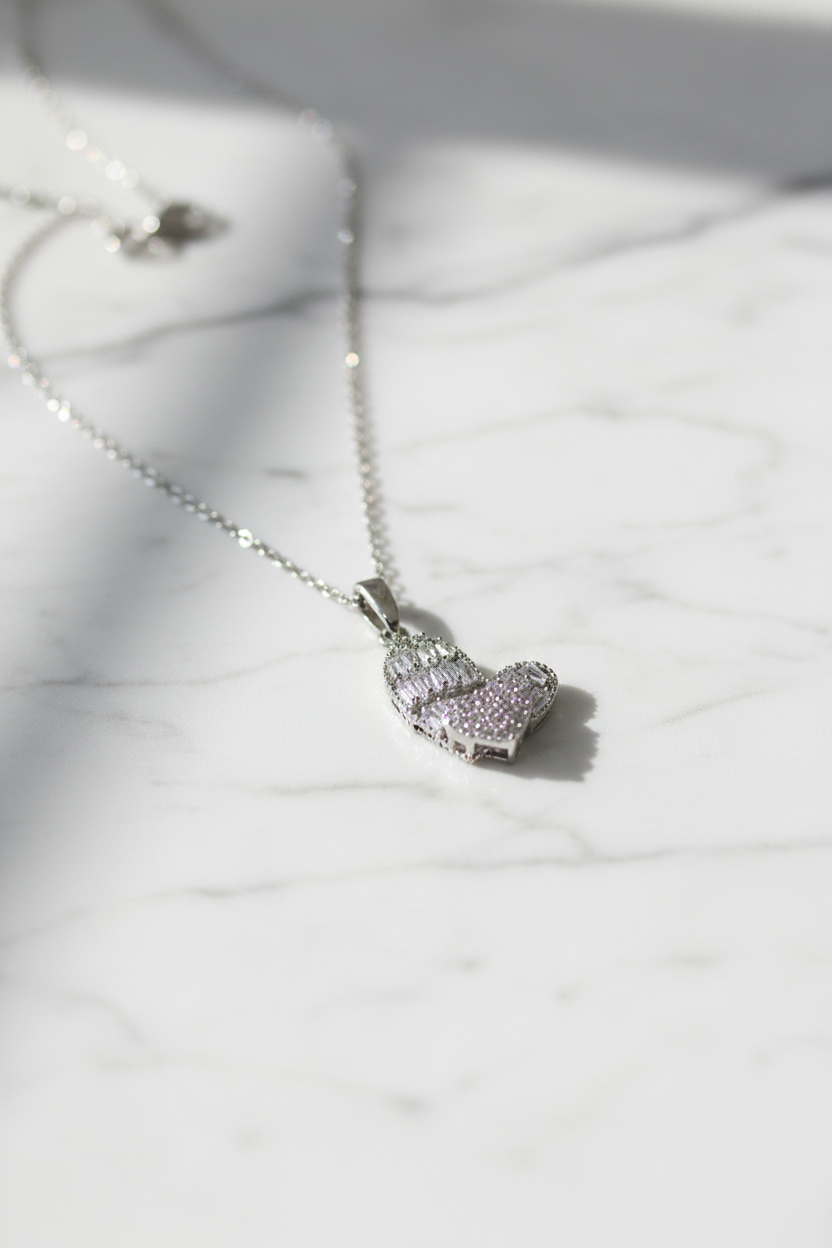 Spinning Heart Crystal Pendant Necklace on marble