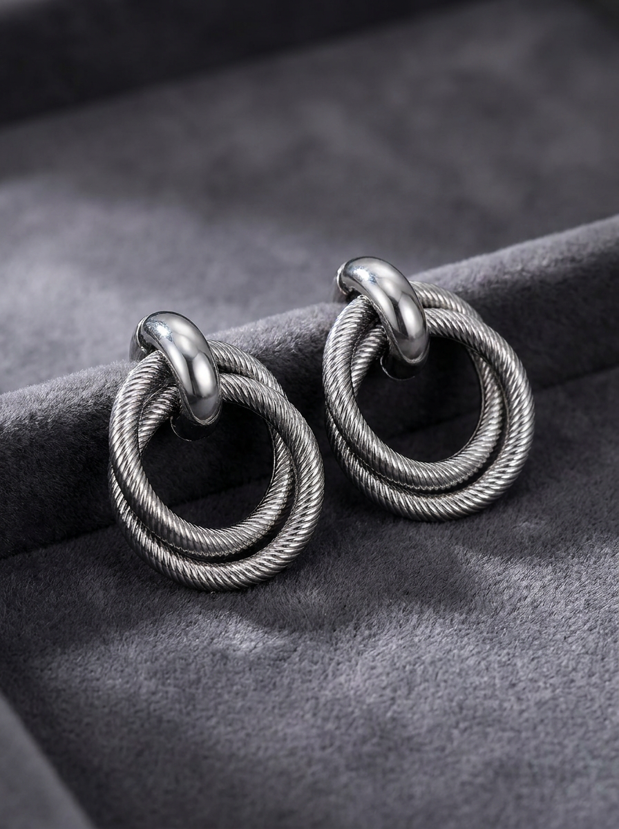 Gunmetal twisted double hoop earrings on black velvet box with 3cm x 2cm size reference