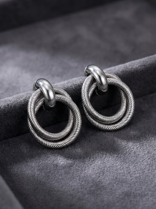 Gunmetal twisted double hoop earrings on black velvet box with 3cm x 2cm size reference
